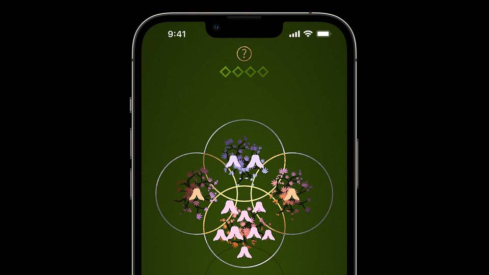 An iPhone showing a game with shining trees on a green background.